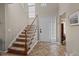 Inviting foyer with a staircase, tile flooring, a coat closet, and a front door with sidelights at 886 Drogheda Pl, Wake Forest, NC 27587