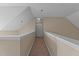 A hallway with neutral walls and carpet lead to a closet or storage area at 886 Drogheda Pl, Wake Forest, NC 27587