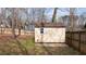 Wooden shed with a window inside a fenced in back yard at 886 Drogheda Pl, Wake Forest, NC 27587