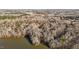 Aerial view of a home surrounded by a dense forest landscape at 1002 Pleasant Dr, Mebane, NC 27302