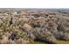 Aerial view of a home surrounded by a dense forest landscape at 1002 Pleasant Dr, Mebane, NC 27302