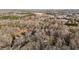 Aerial view of a home surrounded by a forest near a river at 1002 Pleasant Dr, Mebane, NC 27302