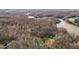 Aerial view of a home in a densely wooded area at 1002 Pleasant Dr, Mebane, NC 27302