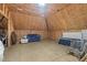 Spacious unfinished attic with insulation and exposed beams offers potential for customization and additional living space at 1002 Pleasant Dr, Mebane, NC 27302