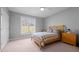 A bedroom with a large window letting in plenty of natural light, and neutral paint at 1002 Pleasant Dr, Mebane, NC 27302