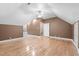 Large upstairs bonus room featuring hardwood floors, neutral paint, and an open floor plan at 1002 Pleasant Dr, Mebane, NC 27302