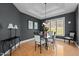 Dining room with decorative lighting, modern furnishings, and a large window with natural light at 1002 Pleasant Dr, Mebane, NC 27302