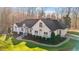 An aerial view of a single Gathering home showing the sidewalk leading to the front door and lush landscaping at 1002 Pleasant Dr, Mebane, NC 27302