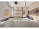 Spacious garage featuring windows, high ceilings, and ample space for storage and vehicles at 1002 Pleasant Dr, Mebane, NC 27302