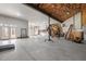 Large garage with high ceilings, ample space for parking and storage or hobbies, and a large door to the outside at 1002 Pleasant Dr, Mebane, NC 27302