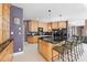 Well-equipped kitchen with an island, breakfast bar, granite countertops, and modern appliances at 1002 Pleasant Dr, Mebane, NC 27302