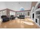 Bright and open living room with vaulted ceiling, hardwood floors and large windows at 1002 Pleasant Dr, Mebane, NC 27302