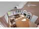 Open-concept living room with vaulted ceilings, lots of natural light from the many windows and skylight, and media center at 1002 Pleasant Dr, Mebane, NC 27302