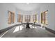 Sun Room featuring walls of windows, light concrete flooring, and a table with chairs at 1002 Pleasant Dr, Mebane, NC 27302