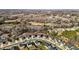 Beautiful aerial view of neighborhood with a pond and lush greenery in a desirable community at 1020 Broadlands Way, Graham, NC 27253