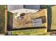 Aerial shot of backyard showing fence, patio, outdoor kitchen, storage shed and more at 1020 Broadlands Way, Graham, NC 27253