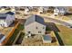 Aerial view of backyard showcasing fenced in yard with patio area and storage shed at 1020 Broadlands Way, Graham, NC 27253