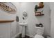Cozy powder room featuring modern fixtures, decorative accents, and a pedestal sink at 1020 Broadlands Way, Graham, NC 27253
