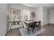 Dining area with a wooden table, seating for six, and a large window for ample natural light at 1020 Broadlands Way, Graham, NC 27253