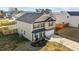 Beautiful two-story home with a well-maintained lawn, attached garage, and inviting front porch at 1020 Broadlands Way, Graham, NC 27253