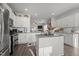 Modern eat-in kitchen with stainless steel appliances and an island open to the living room at 1020 Broadlands Way, Graham, NC 27253