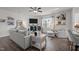 Stylish living room with comfortable seating, a fireplace, and decorative shelving at 1020 Broadlands Way, Graham, NC 27253