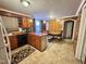 Traditional kitchen with wood cabinets and adjacent dining area at 1043 Cavel Chub Lake Rd, Roxboro, NC 27574