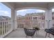 Relaxing balcony features stylish seating and views of the surrounding neighborhood at 10510 Sablewood Dr # 114, Raleigh, NC 27617