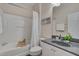 Clean bathroom with a shower-tub combo, vanity with grey countertop, and modern fixtures at 10510 Sablewood Dr # 114, Raleigh, NC 27617