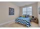 Bright bedroom with large window and space-themed decor, perfect for a room at 10510 Sablewood Dr # 114, Raleigh, NC 27617