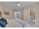 Spacious bedroom featuring a ceiling fan, neutral paint, and two doorways at 10510 Sablewood Dr # 114, Raleigh, NC 27617