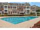 Beautiful community pool surrounded by well-maintained townhomes and lush landscaping at 10510 Sablewood Dr # 114, Raleigh, NC 27617