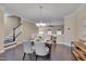Inviting dining room with hardwood floors and a view to the entry stairs at 10510 Sablewood Dr # 114, Raleigh, NC 27617