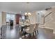 Open concept dining room with seating for six and a kitchen and staircase view at 10510 Sablewood Dr # 114, Raleigh, NC 27617