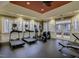 Bright exercise room with treadmills, elliptical machines, and other fitness equipment for a complete workout at 10510 Sablewood Dr # 114, Raleigh, NC 27617