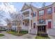 Charming townhome featuring double porches, brick accents, and well-maintained landscaping at 10510 Sablewood Dr # 114, Raleigh, NC 27617