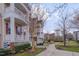 View of townhomes with double porches and well-manicured green spaces in a serene community setting at 10510 Sablewood Dr # 114, Raleigh, NC 27617