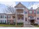 Charming townhome with double porches, brick accents, and beautifully landscaped front yard at 10510 Sablewood Dr # 114, Raleigh, NC 27617
