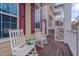 Charming front porch featuring rocking chairs and stylish decor, a perfect spot for relaxing at 10510 Sablewood Dr # 114, Raleigh, NC 27617