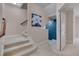 Well-lit hallway with carpeted stairs and neutral wall colors, leading to various rooms at 10510 Sablewood Dr # 114, Raleigh, NC 27617