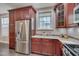 Modern kitchen features stainless steel appliances, granite countertops, and custom wood cabinetry at 10510 Sablewood Dr # 114, Raleigh, NC 27617