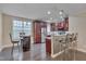 This kitchen features stainless steel appliances, granite countertops, breakfast bar, and dark cabinetry at 10510 Sablewood Dr # 114, Raleigh, NC 27617