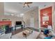 Spacious living room with fireplace, hardwood floors and a ceiling fan and staircase at 10510 Sablewood Dr # 114, Raleigh, NC 27617
