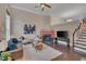 Inviting living room features a cozy fireplace, ceiling fan, hardwood floors and ample natural light at 10510 Sablewood Dr # 114, Raleigh, NC 27617
