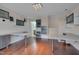 Large office with hardwood floors and modern built-in shelving and desks at 10510 Sablewood Dr # 114, Raleigh, NC 27617