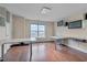 Spacious office with hardwood floors, natural light, and installed desks and shelving at 10510 Sablewood Dr # 114, Raleigh, NC 27617