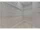 Spacious walk-in closet with ample shelving and carpeted flooring for organized storage at 10510 Sablewood Dr # 114, Raleigh, NC 27617