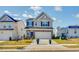 Charming two-story home featuring a stone-accented facade and attached two-car garage at 106 N Finley Landing Pkwy # 1, Smithfield, NC 27577