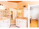 Spacious bathroom featuring double sinks, vanity area, ample counter space, and a separate closet at 10620 Staghound Trl, Zebulon, NC 27597