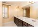 Elegant bathroom featuring double sinks, lots of counter space, and lots of natural light at 10620 Staghound Trl, Zebulon, NC 27597